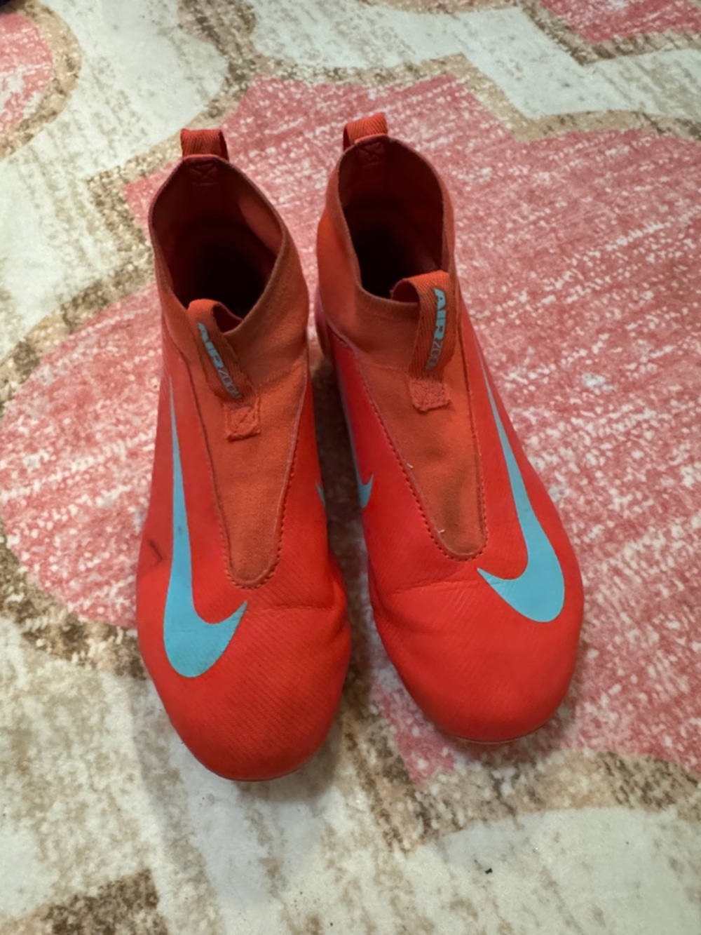 Nike Red Soccer Boots with Light Blue Swoosh